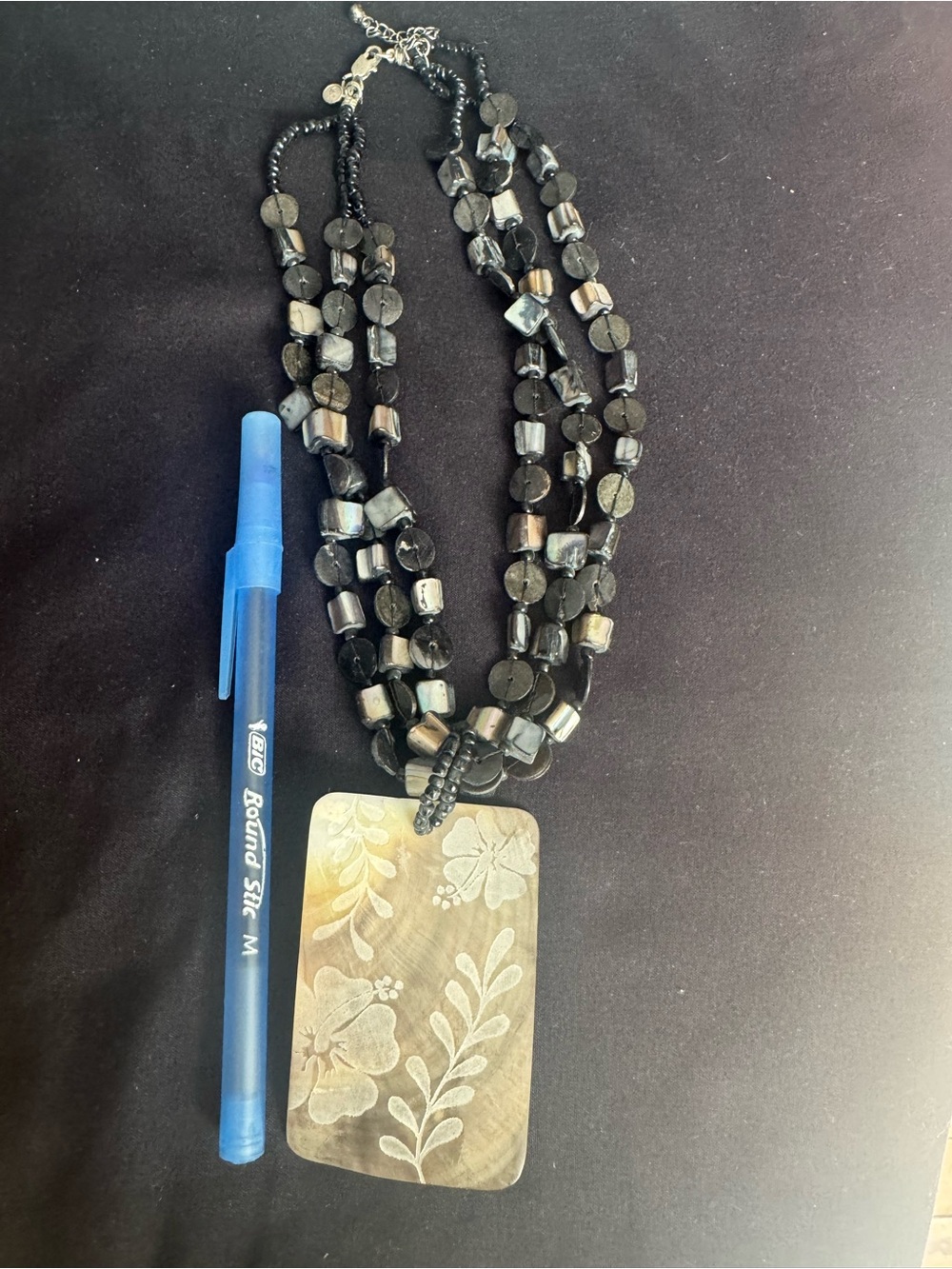 Multi-Strand Black Beaded Necklace with Floral Pendant